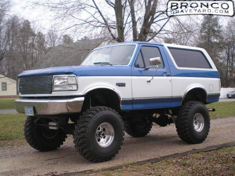 1993 Ford Bronco - This lifted 1992 Ford Bronco features a custom grille and large off-road tires.