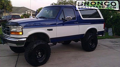 1993 Ford Bronco - This lifted 1993 Ford Bronco is presented in a two-tone blue and white paint scheme.
