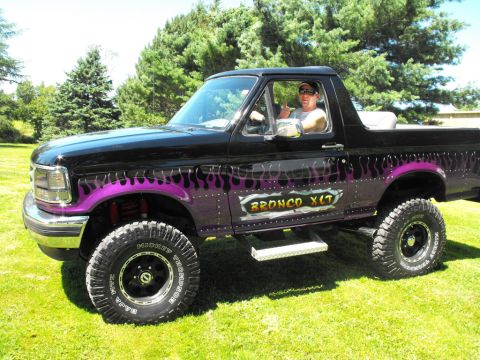 1993 Ford Bronco - This modified Ford Bronco XLT features custom flame graphics and a lifted suspension.