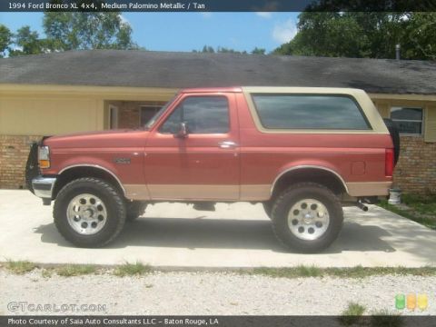 1993 Ford Bronco - This 1994 Ford Bronco is shown in a side profile, a two-tone red and tan paint scheme.