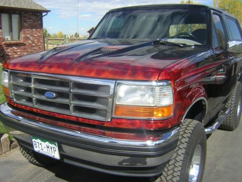 1993 Ford Bronco - This 1993 Ford Bronco features a unique flame paint job over its red body.