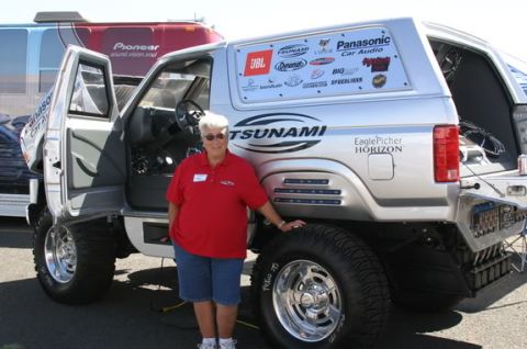 1993 Ford Bronco - Customized 1993 Ford Bronco displays numerous sponsor decals and 'TSUNAMI' branding.