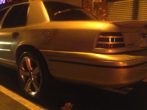 1999 Ford Crown Victoria - The taillights and rear body style indicate this is a later model Ford Crown Victoria, not a 1999.