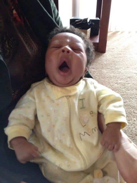 2010 Subaru Legacy - A baby yawns while being held, wearing pajamas that say "I love Mom."