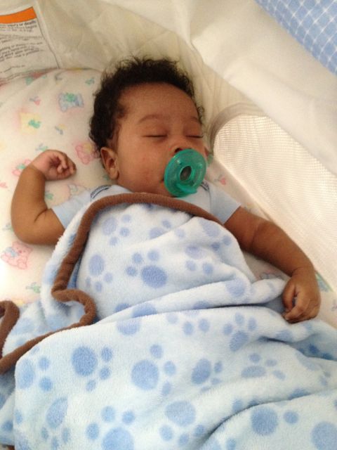 2010 Subaru Legacy - Baby sleeping soundly with a pacifier and paw print blanket.