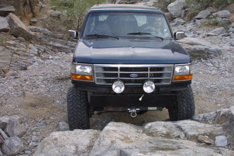 1994 Ford Bronco - This 1994 Ford Bronco navigates a challenging rocky path, its off-road capabilities.