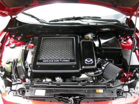 1989 Mazda MX-6 - The engine bay shows a Mazda MZR 2.3 DISI TURBO engine, not a 1989 Mazda MX-6.