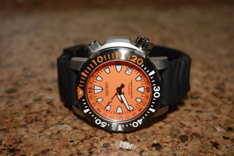 1986 Ford Bronco - This watch has an orange face with white markers and a black bezel.