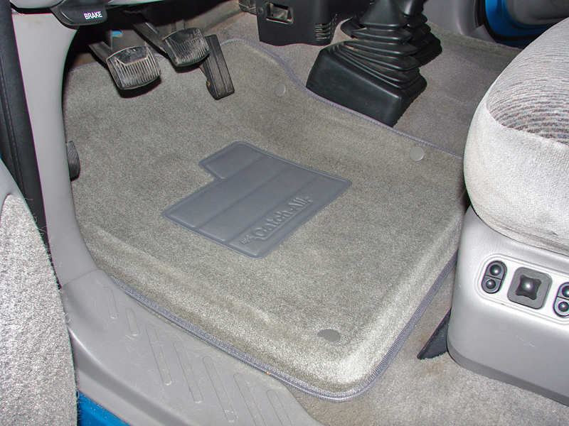 Gray floor mats with 'Catch-All' logo in a vehicle interior