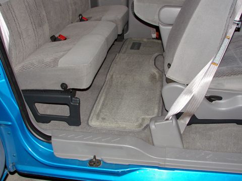 1998 Ford F-150 - The interior of a truck shows the rear seats and floor mats, with a watermark for SuperMotors.net.