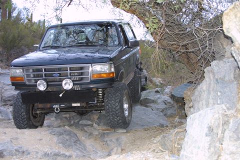1994 Ford Bronco - This 1994 Ford Bronco is shown off-roading through a rocky landscape.