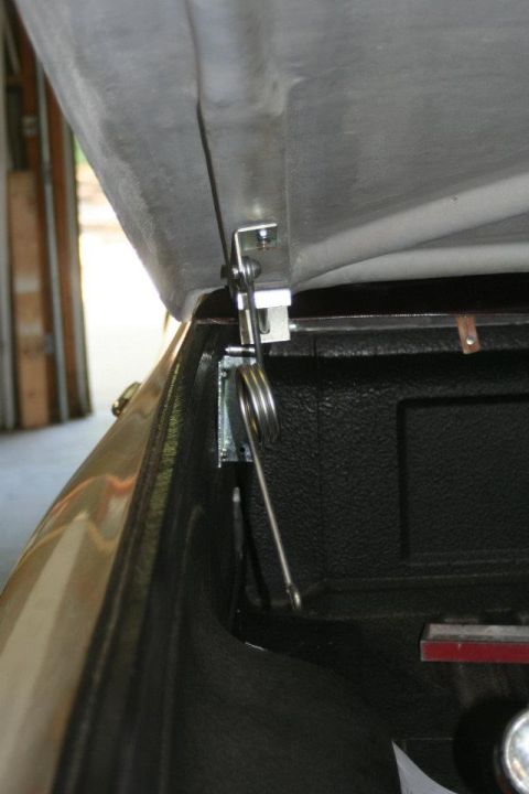 1976 Ford Ranchero - Detail of the hinge and spring mechanism for a truck bed cover.