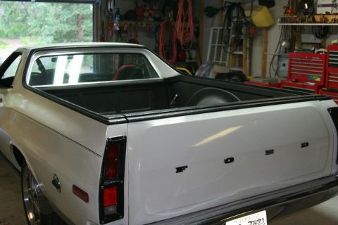 1976 Ford Ranchero - Rear view of a white 1976 Ford Ranchero pickup truck with the Ford logo visible on the tailgate.