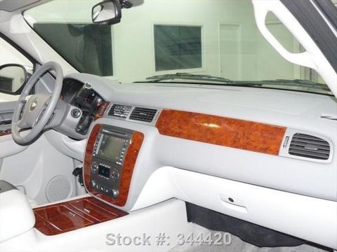 1991 Ford LTD Crown Victoria - The interior of a car is shown with wood grain trim and a central infotainment screen.