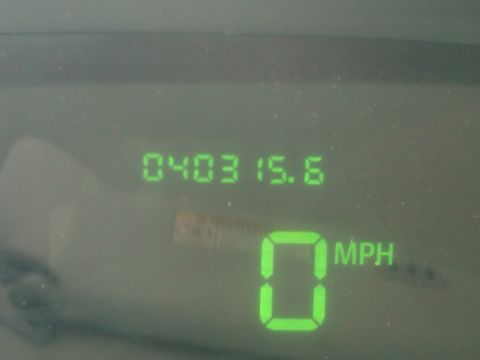 1999 Ford Crown Victoria - Vehicle's digital dashboard displays speed and odometer readings.