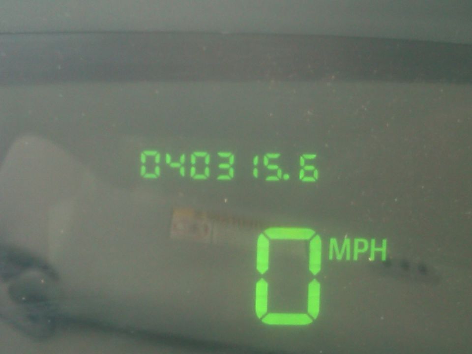 Digital dashboard showing 0 MPH and odometer reading 040315.6