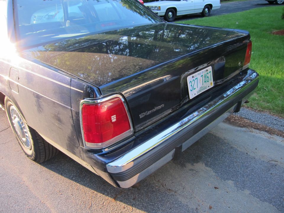 Dark blue 1991 Ford Crown Victoria LTD rear with chrome bumper and license plate 327 7467