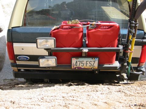 1994 Ford Bronco - Rear view of a Ford Bronco equipped for off-roading with auxiliary fuel cans and tools.
