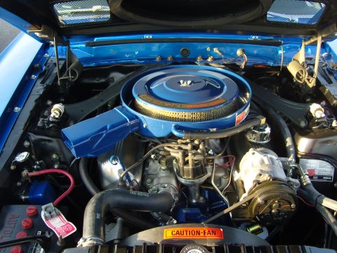 2007 Ford Mustang - Engine bay detail showing a Ford Cobra Jet engine with prominent air cleaner assembly.