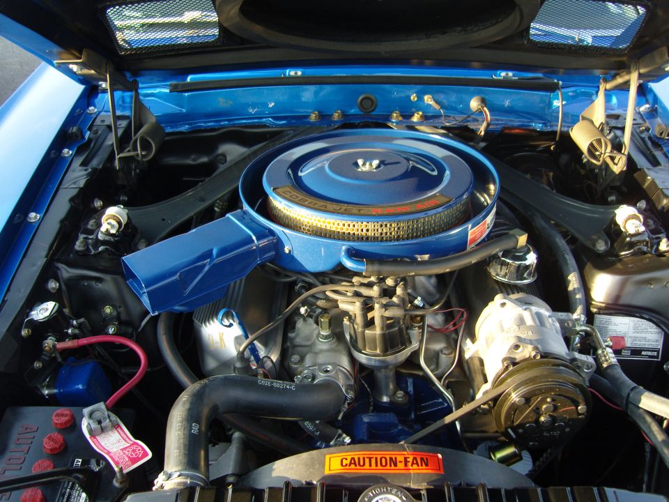 Ford Cobra Jet engine with blue air cleaner and V-belt driven compressor