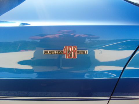 2007 Ford Mustang - Close-up of a Cobra 428 Jet emblem on a blue vehicle's body panel.