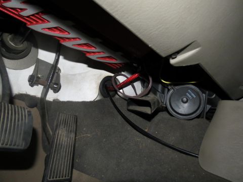 2005 Jeep Wrangler - Close-up view of the driver's side footwell, revealing pedals and various wires.