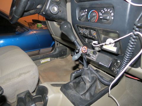 2005 Jeep Wrangler - Interior of a 2005 Jeep Wrangler shows a hand throttle and CB radio installed near the gear shifter.