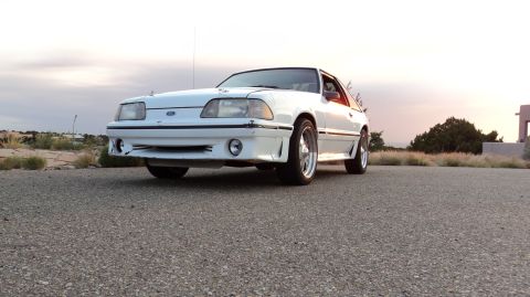1989 Ford Mustang - Front 3/4 view of a white 1989 Ford Mustang with aftermarket wheels.