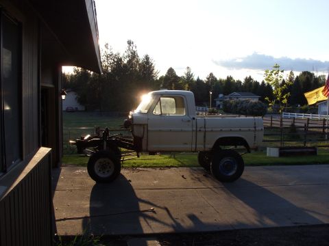 1967 Ford F-250 - A 1967 Ford F-250 pickup truck is seen from the side, appearing to be in a state of restoration.