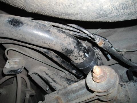 1989 Ford Probe - Underbody view of exhaust and suspension components, with a SuperMotors logo present.