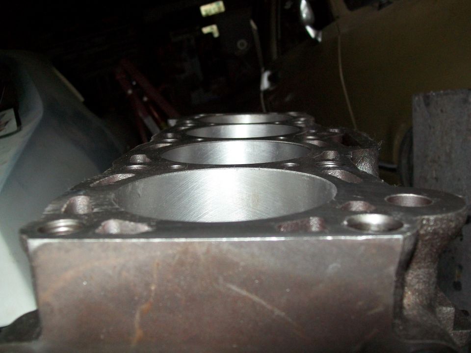 Close-up of an engine cylinder block with visible bores