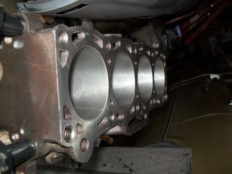 1989 Ford Probe - Close-up view of a four-cylinder engine block, highlighting its internal structure and machining details.
