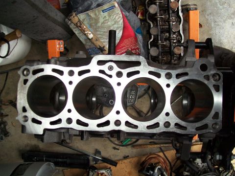 1989 Ford Probe - Close-up of an engine block, showing the cylinder bores and a '22R' marking. The registry claims this is a 1989 Ford Probe, but the image s…