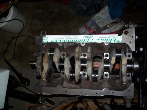 1989 Ford Probe - Engine block with crankshaft and a Plastigage tool is visible in this close-up view.