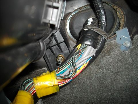 1989 Ford Probe - Vehicle wiring harness with numerous colored wires, taped and secured with zip ties.