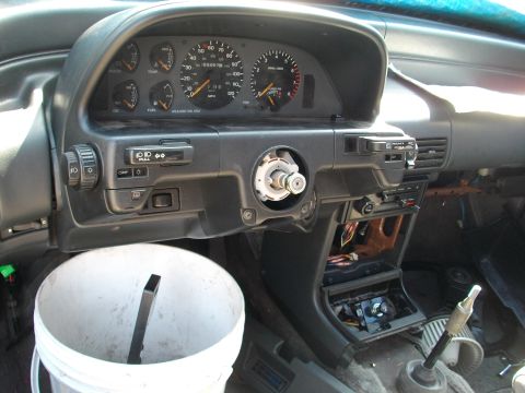 1989 Ford Probe - Interior view of a 1989 Ford Probe, dashboard and steering column disassembled.