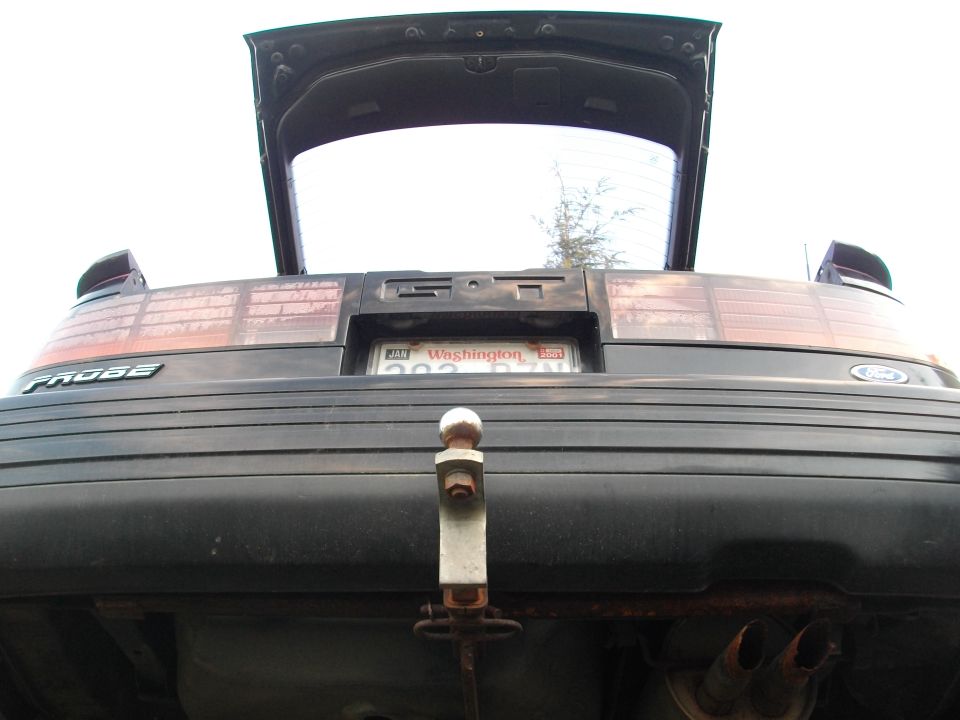Dark hatchback rear with open trunk and 'PROBE' badge