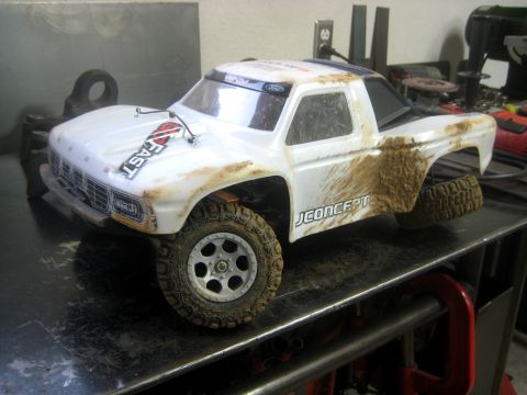 1996 Ford Bronco - This remote-controlled truck is covered in dirt, suggesting it has been used off-road.