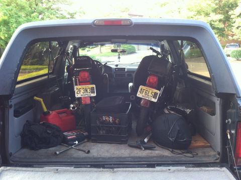 1981 Garelli Rally Sport - Two mopeds are transported inside a vehicle, with a red gas can and tools visible.