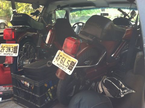 1981 Garelli Rally Sport - Two mopeds are packed inside a vehicle, each with a New Jersey license plate.
