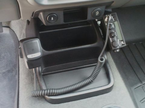 2011 Ford Ranger - A CB radio and microphone are installed in the center console of a vehicle.