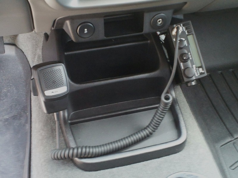 CB radio and microphone mounted in vehicle interior