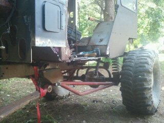 1978 Ford Bronco - This image shows the chassis and suspension of a custom off-road vehicle, with prominent SuperMotors branding.