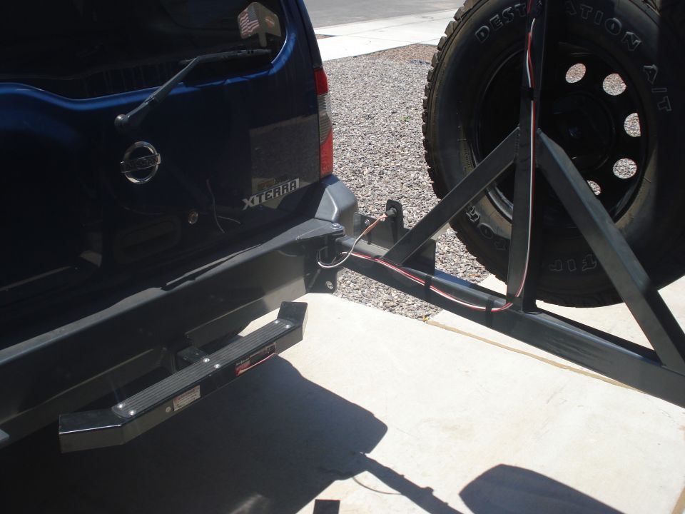 Nissan Xterra rear bumper with aftermarket tire carrier and spare tire