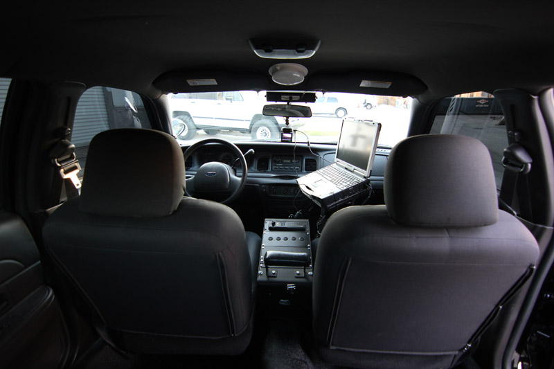 2004 Ford Crown Victoria interior with laptop on console