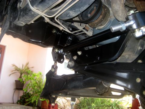 1996 Ford Bronco - Underside view of vehicle steering and suspension system components.