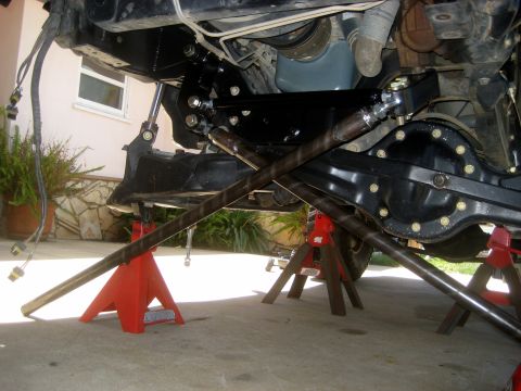 1996 Ford Bronco - Close-up of a vehicle's undercarriage, focusing on the steering and suspension system.