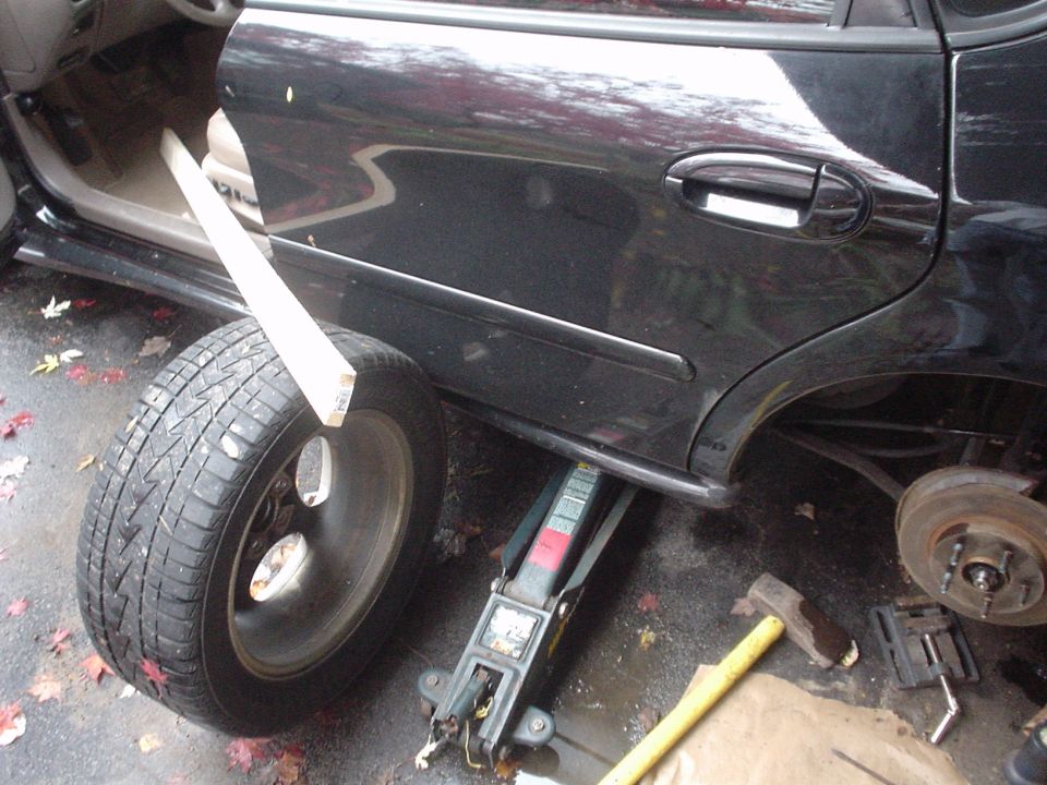 This is my idea of a one-man brake bleeding operation!