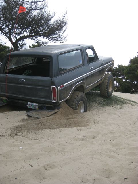 1979 Ford Bronco - This 1979 Ford Bronco is stuck in the sand, with its rear wheel deep in the dune.