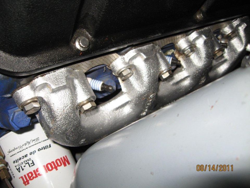 Exhaust manifold AFTER painting with Rust-Oleum silver oil-based paint. NOT high-temp. has lasted over two years now. Big difference.